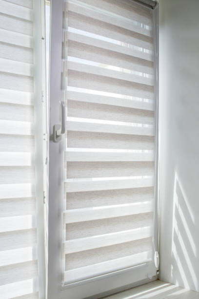 istock Window roller duo system day and night. Close up on roll curtains indoor. 1395753568