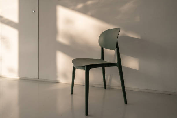 istock The sun shone on the chair by the wall 1395754866