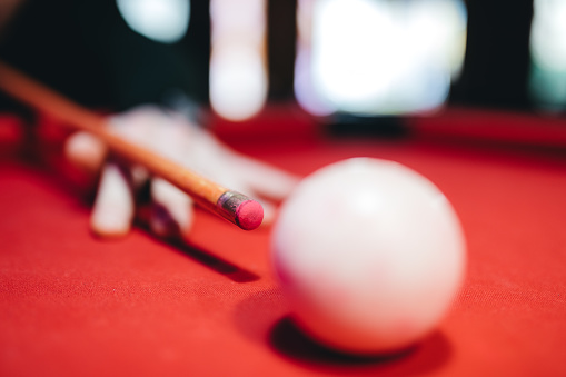 Hitting the cue ball, close up view.