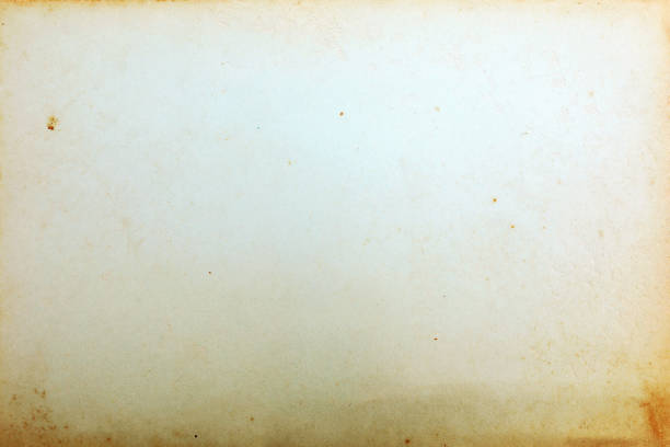 istock Old yellowed paper with stains 1395756585