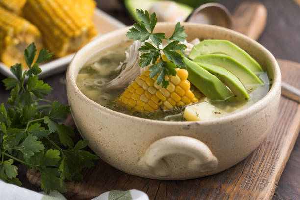 Traditional Ajiaco Colombiano - Colombian Soup with potato, chicken, avocado stock photo