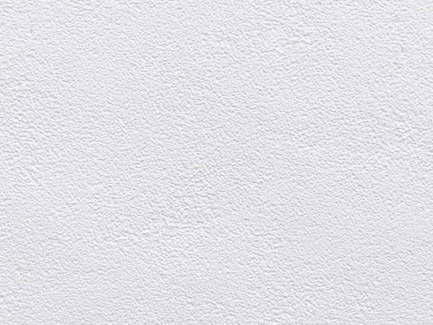 istock White cement texture stone concrete,rock plastered stucco wall; painted flat fade pastel background white grey solid floor grain. Rough top beige empty brushed print sand brick sepia home dirty 1395759595