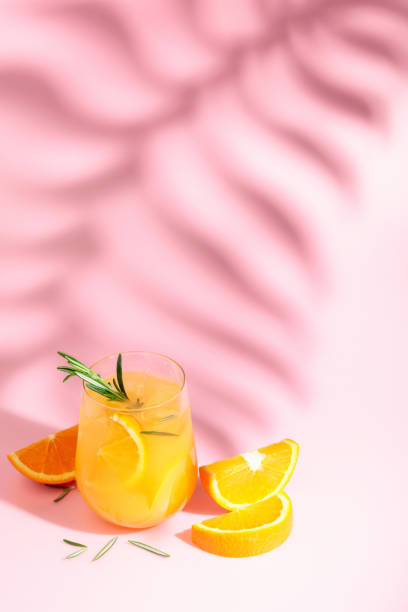 istock Summer cocktail with orange, rosemary, and ice. 1395760545