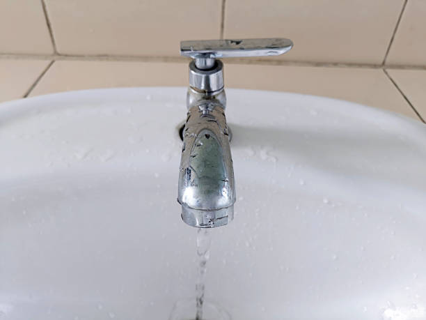 istock Open faucet in bathroom, water is running 1395760908