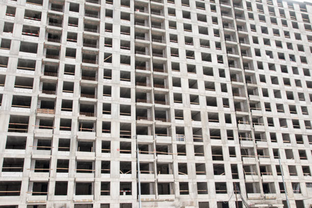 istock building a tall business building. construction site with workers 1395762510