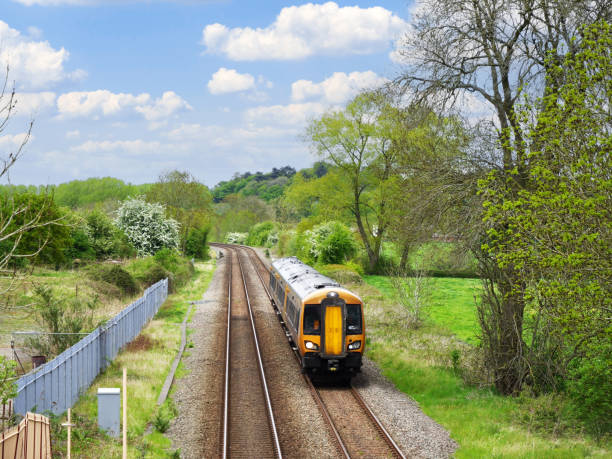 Generic Diesel powered railway line station in the English countryside. A station England UK. Diesel powered railway line in the English countryside. Station on a sunny day. railway signal stock pictures, royalty-free photos & images
