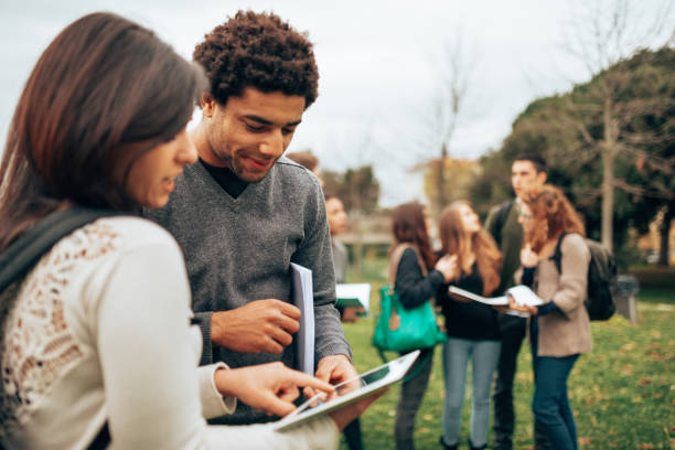 istock group of students at the park 1395764581