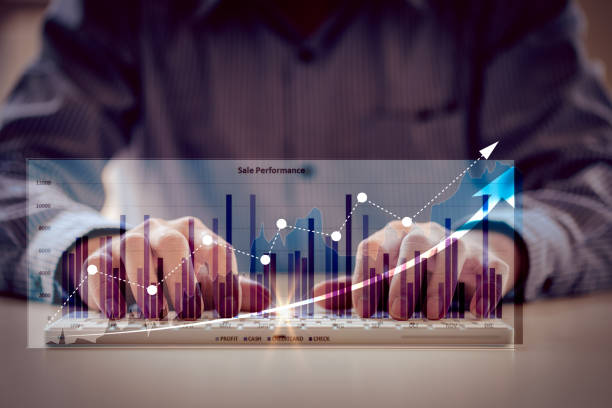 istock Businessman, Analysis and Technology, Finance and Banking Chart from laptop computer using creative backlit hologram keyboard with charts and tables on the global economy and stock concept background. 1395764731