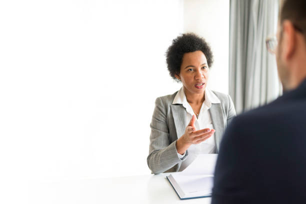 istock Businesswomen talking to client in her office 1395766823