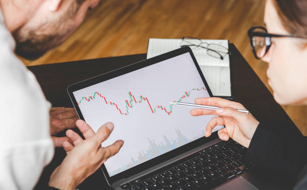 istock Business people working together analyzing the cryptocurrency chart on the laptop display. 1395766861