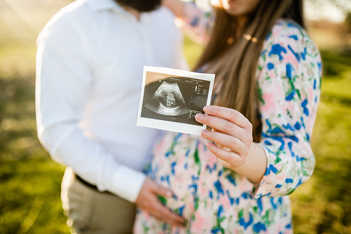 Cheerful couple expecting their first born child