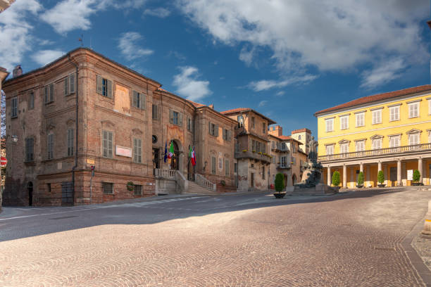 Town hall building of Bra city, Italy Bra; Cuneo; Piedmont; Italy - May 01; 2022: Town hall building of Bra (project by Bernardo Vittone 1897) in piazza Caduti per Liberta with ancient medieval buildings in the background cuneo stock pictures, royalty-free photos & images
