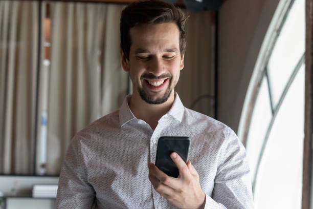 istock Happy confident millennial businessman reading text message on online chat 1395769882