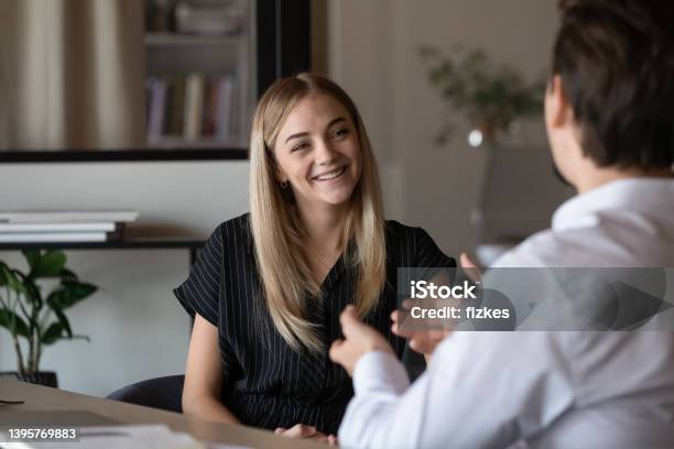 Happy Intern Listening To Mentor Consulting Advisor Stock Photo - Download Image Now