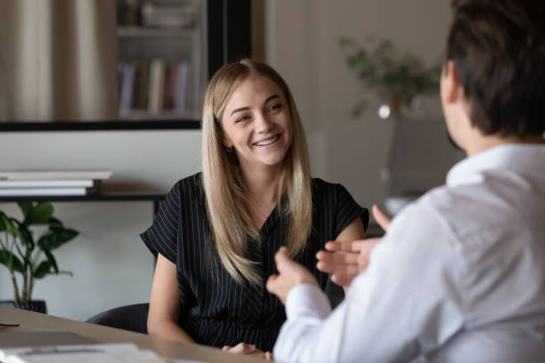 happy intern listening to mentor, consulting advisor - coach imagens e fotografias de stock