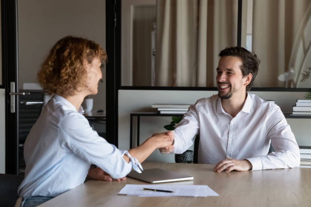 istock Happy employer hiring candidate after interview, congratulating on getting job 1395769956