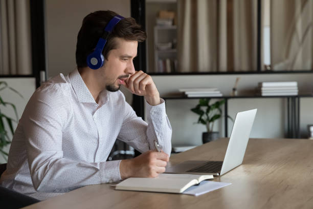 Employee, manager in headset making video call to client