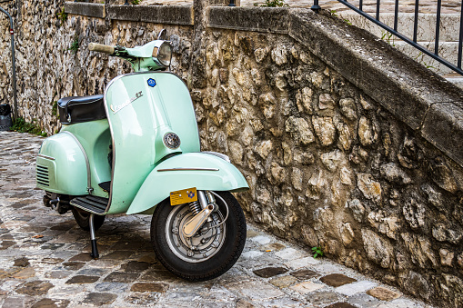 Siena, Italy - October 9:typical italian Vespa Motorscooter (build from Piaggio) at a street in Siena on October 9, 2020