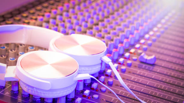 white headphone on audio mixing console. recording, broadcasting concept stock photo