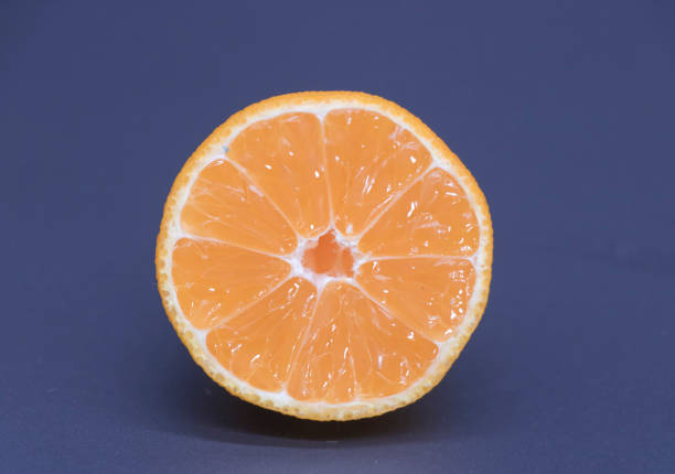 istock kamala or Tangerine slice on black background, selective focus 1395771283