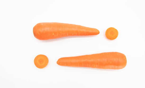 istock fresh Carrot slice over on white background, top view 1395771384