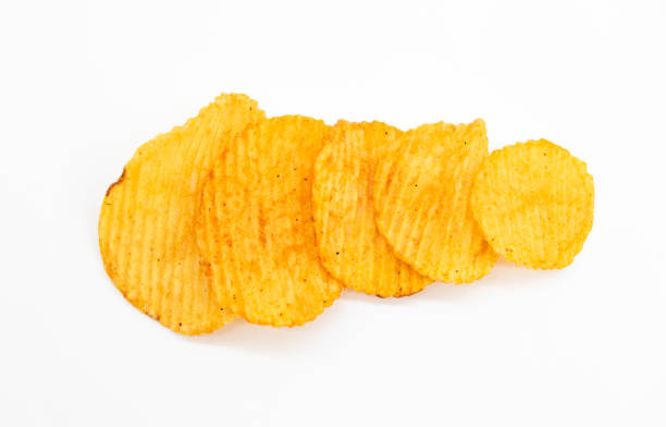 istock heap of potato crisps on white background 1395772606