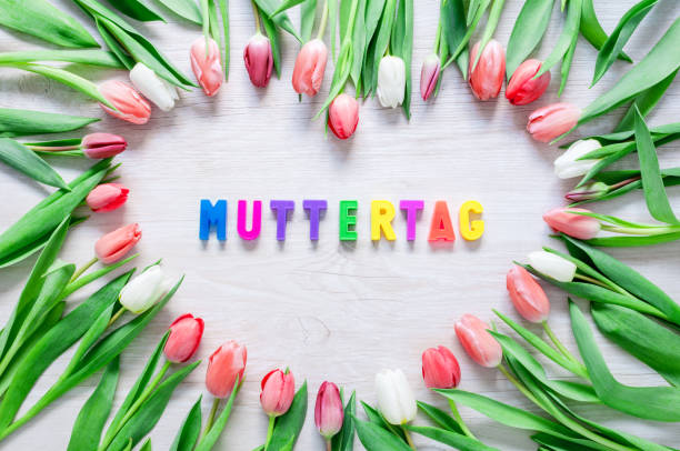 istock Heart from Red Tulips Flowers on rustic table for Mothers day - Closeup 1395773623