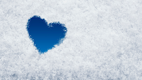 heart on snow texture, top view