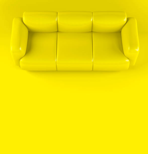 istock Yellow leather soft sofa on yellow background with shadow. Stylish cozy modern sofa made of genuine leather on wooden legs. Minimalistic interior room in yellow colors. Single piece of furniture 1395782885