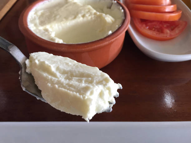 eating yoghurt, yoghurt on the fork with appetizer on the restaurant table - yoğurt stok fotoğraflar ve resimler