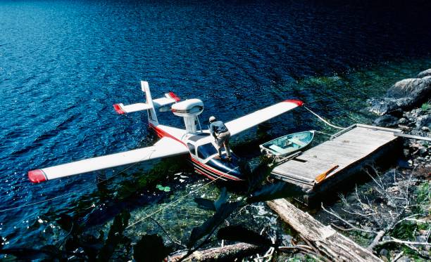 A pilot secures his Lake flying boat for the night on Toquaht Lake. Summer-run wild steelhead swim up the Toquaht River which makes for great fishing. Toquaht Lake is 13.9 miles from Ucluelet in Alberni-Clayoquot Regional District. The Toquaht are the people of Toquaht Bay, Mayne Bay and western Barkley Sound, and are one of the Nuu-chah-nulth Nations who have lived along Vancouver Island’s west coast for over 10,000 years. \