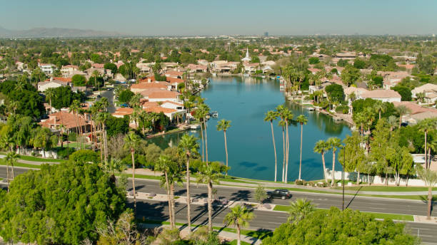 istock Aerial View of Housing Developments on Artificial Lake in Gilbert, Arizona 1395786270