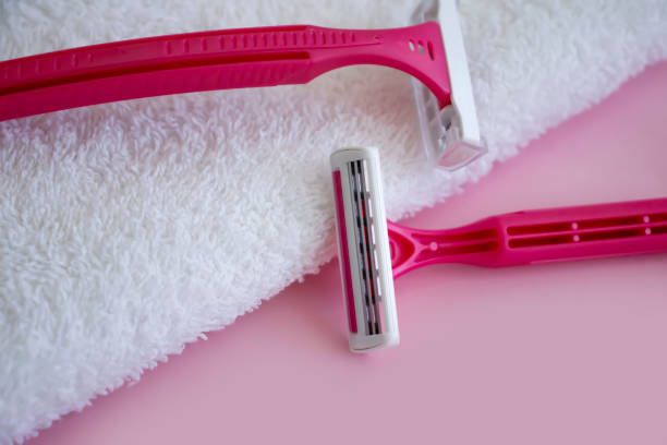 istock pink razor towel on colored background 1395788477