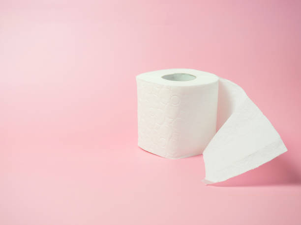 istock Toilet paper roll on pink background, Space for text 1395788493