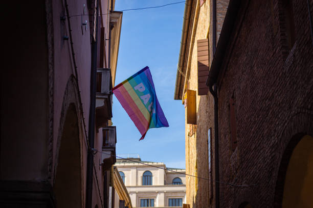 istock LGBT flag hanging from a window 1395788529