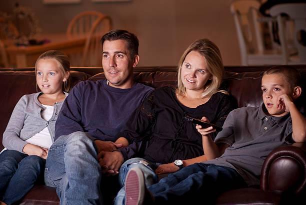 istock Family watching Television together 139579007