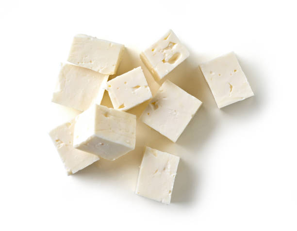 fresh greek fitaki cheese pieces isolated on white background, top view