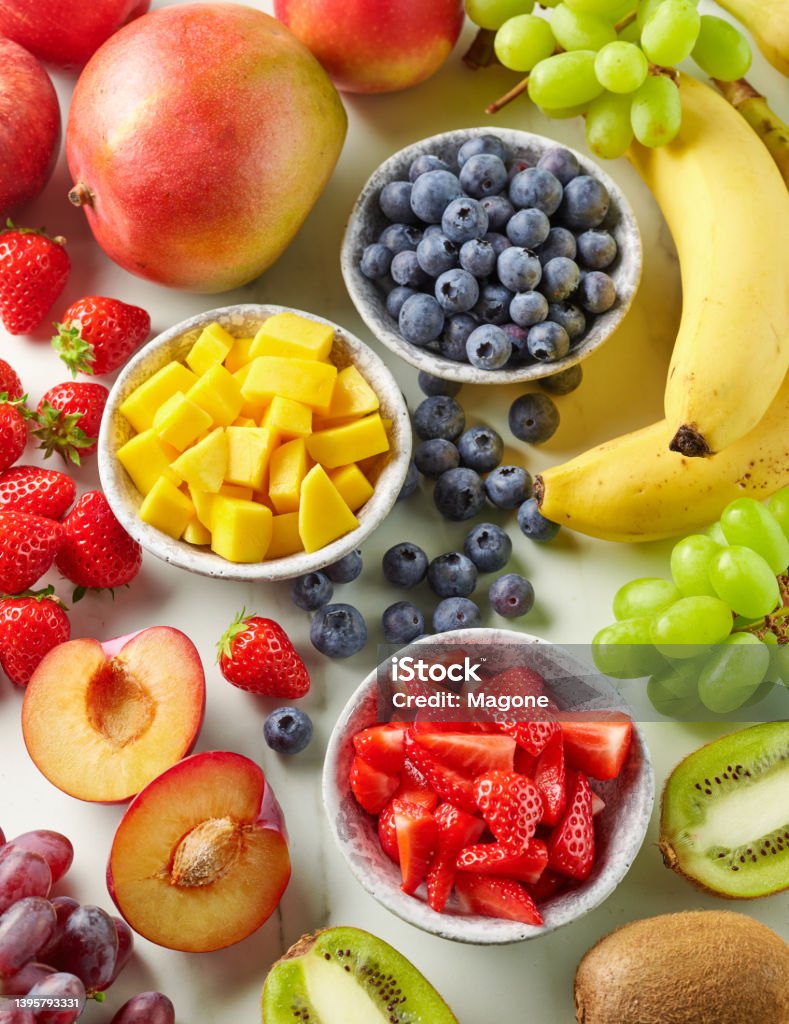 fresh fruit and berries fresh fruit and berries on kitchen table, top view Fruit Stock Photo