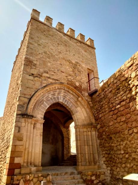 Medieval door bent in the city of Lorca Old medieval gate called San Antonio or Porch of San Ginés, in the second walled enclosure of the city of Lorca, Murcia, Spain lorca stock pictures, royalty-free photos & images