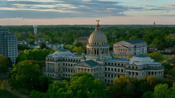 Aerial shot of Mississippi State Capitol and surrounding government buildings in Jackson, Mississippi at sunset.  

Authorization was obtained from the FAA for this operation in restricted airspace.