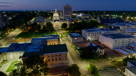 Aerial shot of Mississippi State Capitol and surrounding government buildings in Jackson, Mississippi at sunset.  \n\nAuthorization was obtained from the FAA for this operation in restricted airspace.