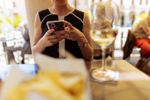 istock Elegant woman enjoying wine 1395795766