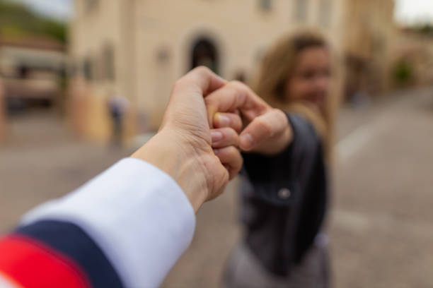 Follow me concept. Young couple in Italy.