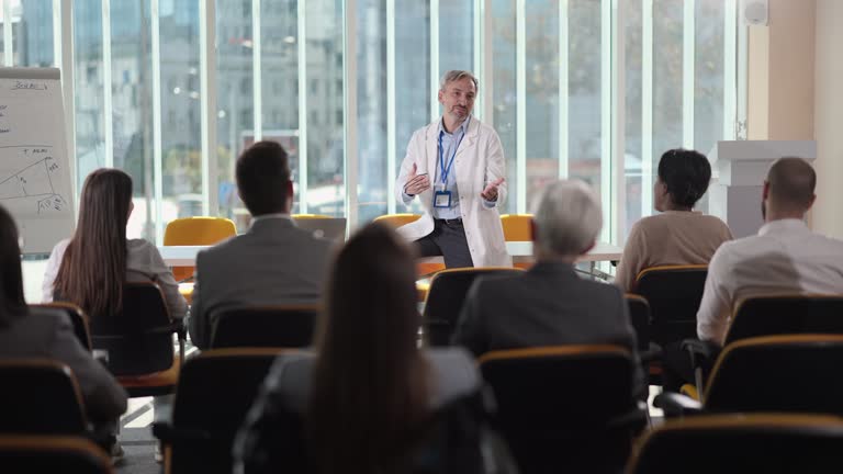 Medical expert leading a seminar in a board room
