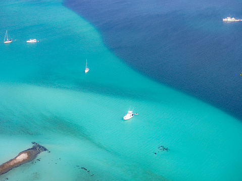 Aerial view of boat anchored on a reef