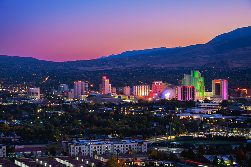 Reno Skyline At Dusk With Illuminations And A Multicolored Sky