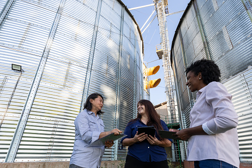 Female engineers working in a grain silo