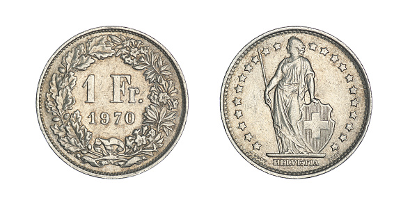 A Czechoslovak koruna coin isolated on a black background.