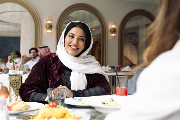 istock Smiling Middle Eastern woman lunching with friend 1395810590