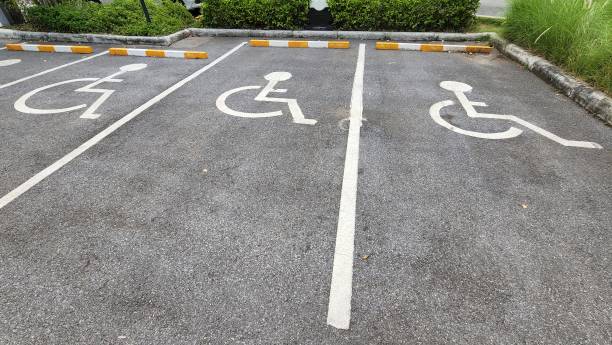 Handicap parking sign. Handicap parking sign on floor. Special lane for disabled people. Car park for handicap. Accessibility for person with disabilities. pavement ends sign stock pictures, royalty-free photos & images